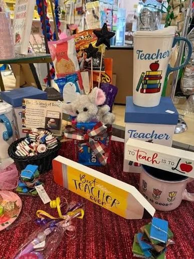 Teacher gift shop display with mug and sign